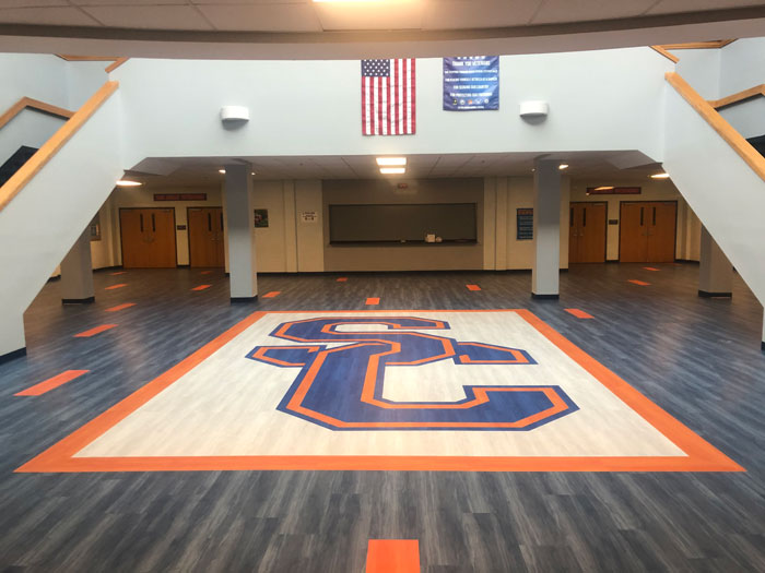 Commercial flooring with logo installed at High School